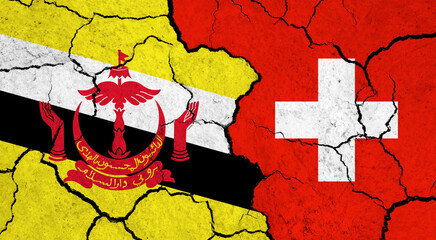 Flags of Brunei and Switzerland on cracked surface - politics, relationship concept