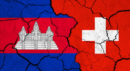 Flags of Cambodia and Switzerland on cracked surface - politics, relationship concept
