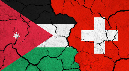 Flags of Jordan and Switzerland on cracked surface - politics, relationship concept