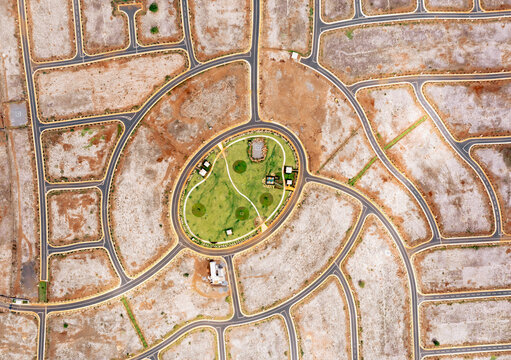 Aerial drone view of a construction site with roundabout streets, Flic en Flac, Black River, Mauritius.