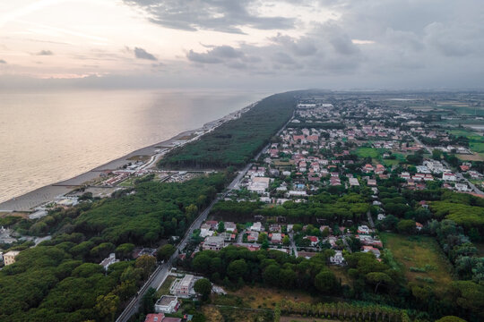 Aerial view of an endless beach along the coastline at sunset facing the Mediterranean Sea, Capaccio, Paestum, Campania, Italy.
