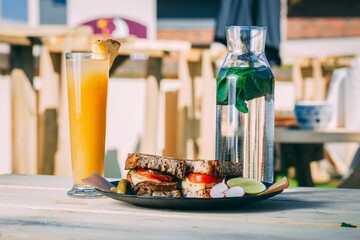 Refreshing drinks and freshly prepared sandwich on a table
