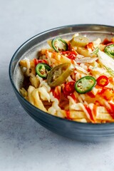 Bowl of french fries topped with sauce