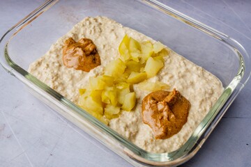 Closeup of a vibrant and transparent bowl of oatmeal topped with fresh fruits