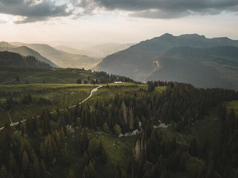 Aerial drone view a clearing in the woods over the valley of Wildhaus in St. Gallen, Switzerland.