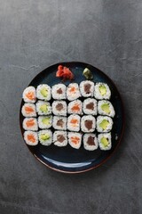 Top view of an appetizing arrangement of sushi rolls on a blue plate