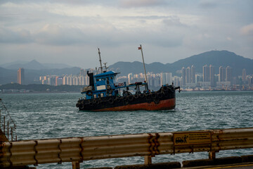 Obraz premium Large fishing boats docked by the sea in Hong Kong