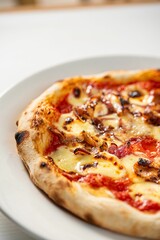 Vertical shot of a delicious freshly made pizza on the table