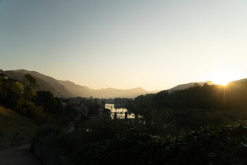 Stunning view of the town of Iseo tucked away behind lush green trees and hills