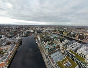 Obraz premium Aerial view of Dublin City with urban buildings and houses near Grand Canal