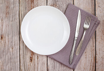 White plate on wooden background