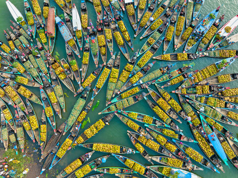 Aerial view of floating market of seasonal fruits on the boats in Kaptai Lake, Rangamati, Bangladesh.