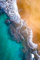 Aerial view of a picturesque beach surrounded by crystal blue waves lapping against the shoreline © 11eleven Photography/Wirestock Creators