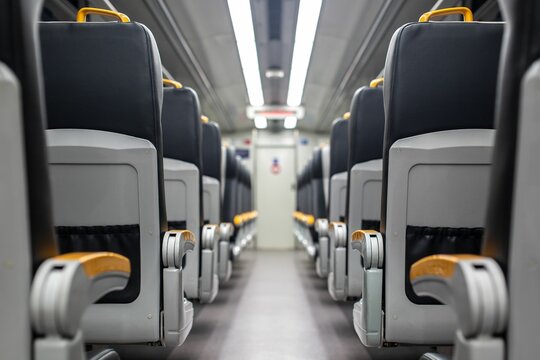 A photograph of the interior of an empty passenger train car