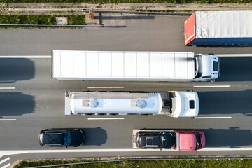 Big freight trucks on a highway with motion blur effect