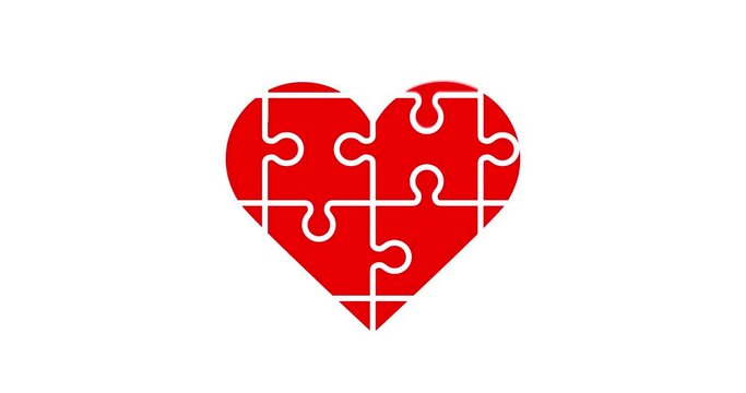 Process of assembling of a Red Heart Puzzle Shape on white background
