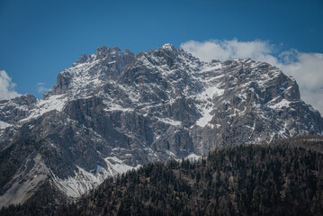 landscape of beautiful mountains in the alps cloudy day with blue sky