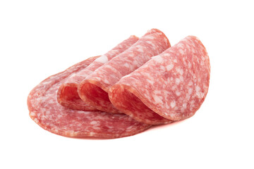 Sliced smoked sausage with fat on a white background.