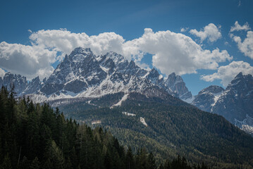 landscape of beautiful mountains in the alps cloudy day with blue sky