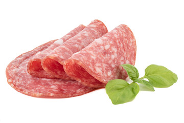Green basil and sliced smoked sausage with fat on a white background.