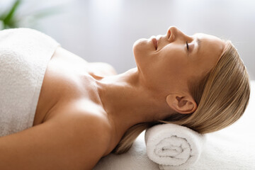 Attractive Middle Aged Woman Relaxing During Spa Treatment In Beauty Salon