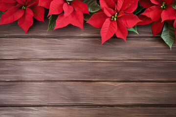 Poinsettias flowers on the brown wooden table, top view, Christmas background