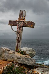Wooden cross on the seashore in Malin Head, County Donegal, Ireland