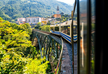 View out of a coach of the Centovalli railway, a popular narrow gauge train connecting Locarno...