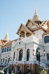 Fototapeta na wymiar Closeup of the Dusit Maha Prasat Hall under the blue sky in Bangkok