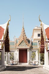 Fototapeta premium Closeup of The Temple of the Emerald Buddha under the blue sky in Bangkok