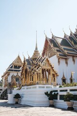 Fototapeta premium Closeup of the Dusit Maha Prasat Hall under the blue sky in Bangkok