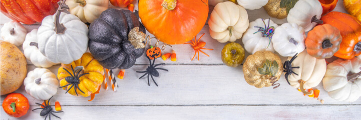 Thanksgiving, Halloween fall autumn season holiday background with colorful pumpkins. Stack of...