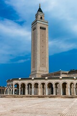 Fototapeta premium Stunning shot of a mosque in Tunisia, surrounded by an azure blue sky