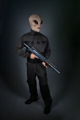 Fototapeta premium Male Alien Soldier Standing with Gun 