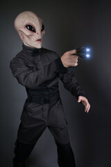 Male Alien Soldier Standing with Gun 