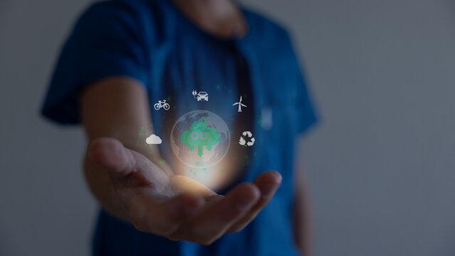 Hand holding virtual Global with CO2 reducing icon for concept of decrease carbon dioxide emission ,carbon footprint and carbon credit to limit global warming from climate change concept. - Powered by Adobe