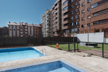 Summer pools in an urban development prepared for a refreshing dip and lie