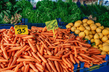 Carrot sale in the traditional farm Turkish market, a counter filled with fresh fruits