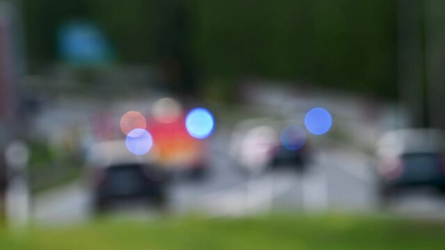 Bokeh view of car accident rescue, Flashing lights of ambulance, police and fire engine.