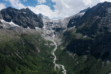aerial view of the waterfalls produced by the left section of the Adamello glacier in Trentino