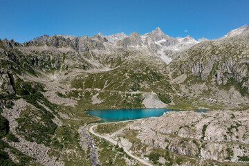 aerial view of cornisello lake surrounded by mountains in trentino