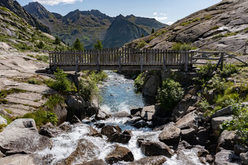 frontal aerial view of the wooden bridge over the cornisello lake in trentino