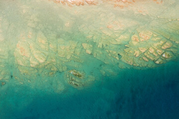vertical aerial view of the rocky seabed of lake garda near sirmione