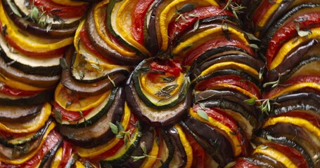 Vegan french tian in rotation, top view, close up view. Traditional vegetable dish