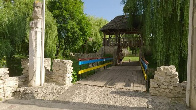 Promenade with dog in Topilche Park, Ternopil, Ukraine, Europe. Fresh green view of Seret river. Traveling concept background. 4K video (Ultra High Definition).