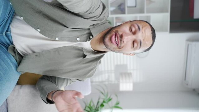 POV Point of view shot vertical video joyful African American man calling friends making online video call Male student holding mobile cell phone smartphone look at camera speaking greating and talk