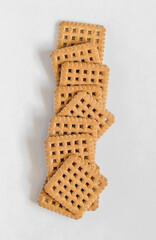 Sugary square sortbread on a white background.