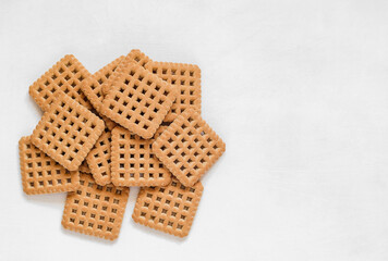 Heap of sweet cookies on a white background. Top view Copy space.