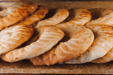Flatbread uzbek fresh bread from oven. Automated bakery production line, food industry