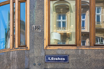 Vienna, Austria - June 13, 2023: Wall plaques with district number and street name in Vienna